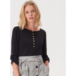 Bawełniana bluzka z guzikami - Czarny. Czarne bluzki damskie Sinsay, s, bez wzorów, z bawełny, bez kołnierzyka, bez rękawów. Za 24,99 zł.