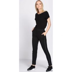 Czarne Spodnie Dresowe Extradition. Szare spodnie dresowe damskie marki New Balance, xs, z dresówki. Za 54,99 zł.