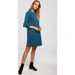 Sukienka trapezowa z falbankami morska - 2xl. Zielone sukienki damskie e-margeritka.pl, na co dzień, s, bez wzorów, z bawełny, eleganckie, z falbankami, z długim rękawem, długie, mini, proste. Za 144,99 zł.