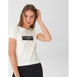 T-shirt z napisem - Kremowy. Białe t-shirty damskie House, s, z napisami, bez kołnierzyka. Za 29,99 zł.
