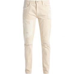 Polo Ralph Lauren ASTOR Jeansy Slim Fit cream. Białe jeansy damskie marki Polo Ralph Lauren, z bawełny. W wyprzedaży za 734,30 zł.
