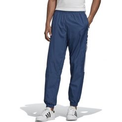 ADIDAS TRACK PANTS > FM9885. Spodnie męskie Adidas, xl, w paski, z poliesteru, klasyczne. W wyprzedaży za 189,99 zł.