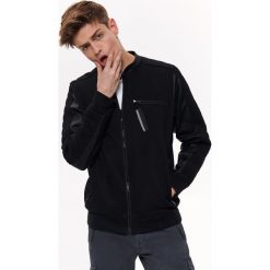Bluza typu biker. Czarne bluzy męskie Top Secret, na lato, xl, bez wzorów, z materiału, ze stójką, bez rękawów, bez kaptura. W wyprzedaży za 89,99 zł.