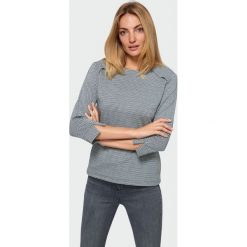 Wzorzysta bluzka z nadrukiem w pepitkę. Bluzki damskie Greenpoint, z nadrukiem, z elastanu, bez kołnierzyka, bez rękawów. Za 39,99 zł.