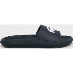 Lacoste - Klapki. Niebieskie klapki damskie Lacoste, bez wzorów, z gumy, bez obcasa, na obcasie. W wyprzedaży za 129,90 zł.