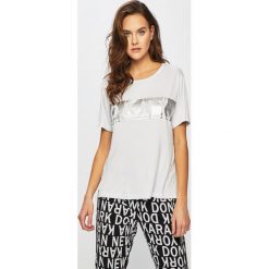 Dkny - Top. Białe bluzki damskie DKNY, s, z nadrukiem, z elastanu, casualowe, z okrągłym kołnierzem. W wyprzedaży za 169,90 zł.