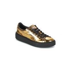 Buty Puma WNS BASKET PLATFORM.GOLD. Żółte trampki i tenisówki damskie marki Puma, bez wzorów, bez zapięcia. Za 299,99 zł.