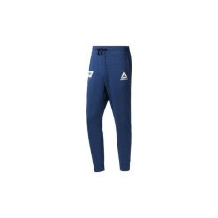 Spodnie treningowe Reebok Sport Spodnie dresowe UFC Fan Gear. Niebieskie bez kategorii Reebok Sport, z dresówki. Za 199,00 zł.