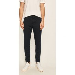 Clean Cut Copenhagen - Spodnie. Niebieskie spodnie męskie Clean Cut Copenhagen, s, bez wzorów, z elastanu. Za 389,90 zł.