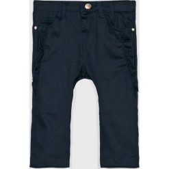 Blukids - Spodnie dziecięce 74-98 cm. Niebieskie spodnie dziewczęce Blukids, bez wzorów, z elastanu, casualowe. W wyprzedaży za 39,90 zł.