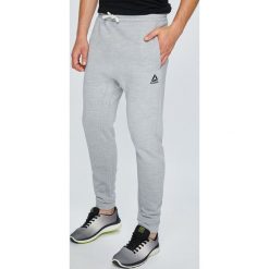Reebok - Spodnie. Szare spodnie męskie Reebok, na co dzień, xl, bez wzorów, z bawełny, sportowe. W wyprzedaży za 149,90 zł.