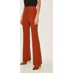 Dkny - Spodnie. Żółte spodnie damskie DKNY, s, z haftami, z poliesteru, z podwyższonym stanem. W wyprzedaży za 349,90 zł.