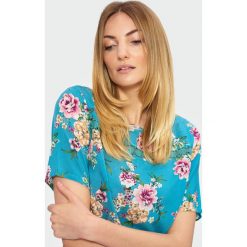 Bluzka z motywem kwiatowym. Szare bluzki damskie Greenpoint, bez wzorów, z wiskozy, bez kołnierzyka, bez rękawów. Za 89,99 zł.