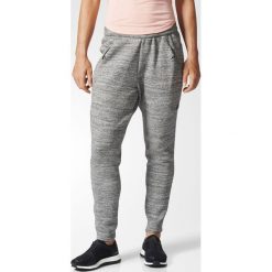 SPODNIE ZNE ROADTR PANT. Szare spodnie damskie Adidas, na wiosnę, bez wzorów, z elastanu. Za 119,99 zł.