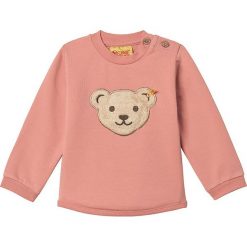 Bluza w kolorze łososiowym. Różowe bluzy niemowlęce Steiff, z aplikacjami, bez rękawów, bez kaptura. W wyprzedaży za 45,95 zł.