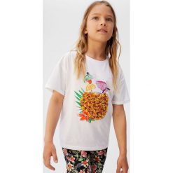 Mango Kids - Top dziecięcy Chiffy 110-164 cm. Białe bluzki dziewczęce Mango Kids, z nadrukiem, z bawełny, z okrągłym kołnierzem, z krótkim rękawem, krótkie, bez kaptura. W wyprzedaży za 29,90 zł.