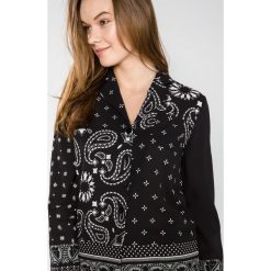 Desigual Capanema Bluzka Czarny. Czarne bluzki damskie Desigual, m, bez wzorów, z poliesteru, bez kołnierzyka, bez rękawów. Za 481,95 zł.