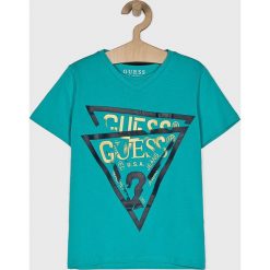 Guess Jeans - T-shirt dziecięcy 118-175 cm. Białe t-shirty chłopięce marki Guess Jeans, z nadrukiem, z bawełny, bez rękawów. Za 79,90 zł.