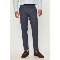 Tommy Hilfiger Tailored - Spodnie. Niebieskie spodnie męskie Tommy Hilfiger Tailored, na co dzień, bez wzorów, z elastanu. Za 579,90 zł.