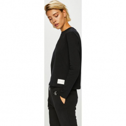 Calvin Klein Jeans - Bluzka. Czarne bluzki damskie marki Calvin Klein Jeans, na co dzień, s, bez wzorów, z bawełny, casualowe, z okrągłym kołnierzem, bez rękawów. Za 229,90 zł.