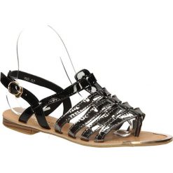Sandały casu we-57. Czarne sandały damskie Casu, bez wzorów, ze skóry ekologicznej, eleganckie, bez obcasa, bez zapięcia. Za 79,99 zł.