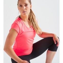 Koszulka fitness kardio damska 100 różowa. Różowe t-shirty damskie DOMYOS, bez wzorów, z elastanu, bez kołnierzyka. Za 19,99 zł.