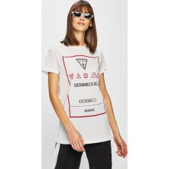 Guess Jeans - Top. Czarne bluzki damskie Guess Jeans, s, z nadrukiem, z bawełny, z okrągłym kołnierzem. W wyprzedaży za 129,90 zł.