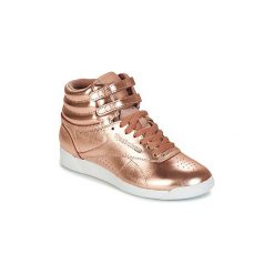 Buty Reebok Classic F/S HI METALLIC. Żółte trampki i tenisówki damskie Reebok Classic, bez wzorów, bez zapięcia. Za 219,50 zł.