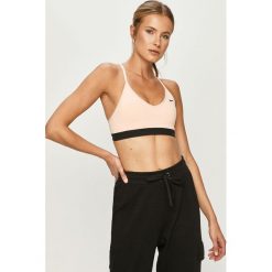 Nike - Biustonosz sportowy. Pomarańczowe biustonosze sportowe damskie Nike, s, bez wzorów, z elastanu, dri-fit (nike). W wyprzedaży za 109,90 zł.