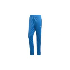 Spodnie treningowe adidas Spodnie dresowe SST. Niebieskie spodnie męskie Adidas, s, bez wzorów, z dresówki. Za 249,00 zł.