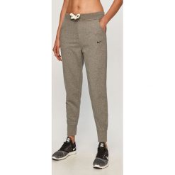 Nike - Legginsy. Szare spodnie damskie Nike, s, z elastanu. Za 199,90 zł.