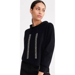 Bluza z dzianiny swetrowej - Czarny. Czarne bluzy damskie Reserved, s, bez wzorów, z dzianiny, bez rękawów, bez kaptura. Za 119,99 zł.