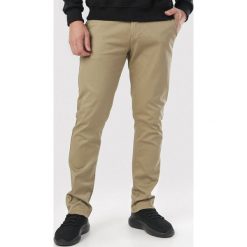 Khaki Spodnie Geninna. Brązowe spodnie męskie Born2be, m, bez wzorów, z tkaniny. Za 109,99 zł.