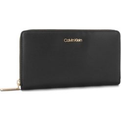 Duży Portfel Damski CALVIN KLEIN - Fold Large Zip Aroun K60K604491 001. Czarne portfele damskie Calvin Klein, ze skóry ekologicznej. Za 299,00 zł.