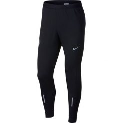 Spodnie do biegania męskie NIKE DRY PHENOM RUNNING PANT / 857838-010. Czarne spodnie męskie Nike, m, bez wzorów. Za 223,00 zł.