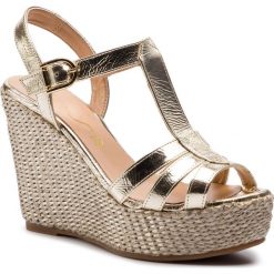 Espadryle UNISA - Maca 19 Mer Platino. Żółte espadryle damskie marki Unisa, bez wzorów, ze skóry, bez obcasa, na obcasie. Za 429,00 zł.