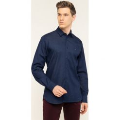 Koszula TOMMY HILFIGER Flex Denim MW0MW12206. Niebieskie koszule męskie TOMMY HILFIGER, m, bez wzorów, z elastanu, casualowe, bez kołnierzyka, bez rękawów. W wyprzedaży za 299,00 zł.
