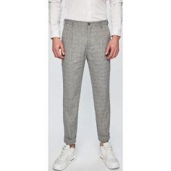 Tommy Hilfiger Tailored - Spodnie. Szare spodnie męskie Tommy Hilfiger Tailored, bez wzorów, z bawełny. W wyprzedaży za 359,90 zł.