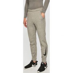 Nike - Spodnie. Szare spodnie męskie Nike, s, bez wzorów, z poliesteru, sportowe. Za 179,90 zł.