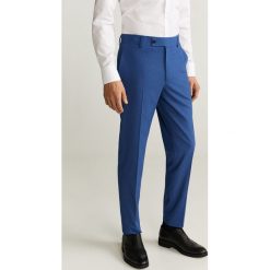 Mango Man - Spodnie BRASILIA. Niebieskie spodnie męskie Mango Man, z haftami, z elastanu. W wyprzedaży za 159,90 zł.