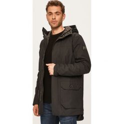 Helly Hansen - Kurtka. Czarne płaszcze męskie Helly Hansen, xl, bez wzorów, z poliesteru, długie, z kapturem. Za 999,90 zł.