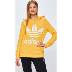 Adidas Originals - Bluza Trefoil Hoodie. Żółte bluzy damskie adidas Originals, z nadrukiem, z bawełny, bez rękawów, z kapturem. W wyprzedaży za 239,90 zł.