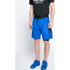 Reebok - Szorty. Niebieskie spodenki sportowe męskie marki Reebok, xl, z elastanu, sportowe. W wyprzedaży za 119,90 zł.
