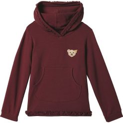 Bluza w kolorze ciemnoczerwonym. Czerwone bluzy niemowlęce Steiff, z aplikacjami, bez rękawów, bez kaptura. W wyprzedaży za 58,95 zł.