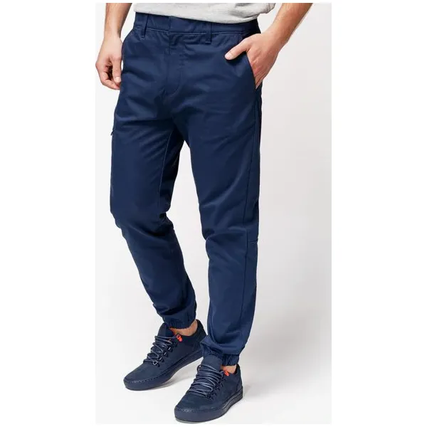 Timberland Spodnie Lovell Lake Slim Tapered Utility Jogger , granatowy, rozmiar 30/32. Niebieskie spodnie męskie Timberland, m, bez wzorów, z bawełny, klasyczne. W wyprzedaży za 349,99 zł.