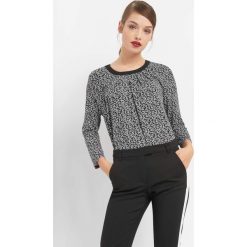 Koszulka w kwiaty. Czarne t-shirty damskie Orsay, xs, w kwiaty, z elastanu, z okrągłym kołnierzem, z długim rękawem. W wyprzedaży za 55,00 zł.