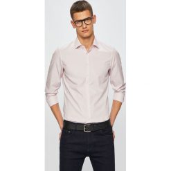 Calvin Klein - Koszula. Niebieskie koszule męskie Calvin Klein, bez wzorów, z bawełny, klasyczne, z klasycznym kołnierzykiem, z długim rękawem. W wyprzedaży za 219,90 zł.