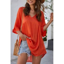 Tunika VELERA ORANGE. Pomarańczowe tuniki damskie IVET, na co dzień, na lato, bez wzorów, bez kołnierzyka, bez rękawów. W wyprzedaży za 89,00 zł.