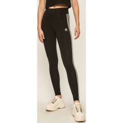 Adidas Originals - Legginsy. Czarne spodnie damskie adidas Originals, bez wzorów, z elastanu. Za 129,90 zł.