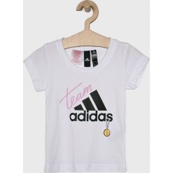 Adidas Performance - Top dziecięcy 110-170 cm. Białe bluzki dziewczęce marki adidas Performance, z nadrukiem, z bawełny, z okrągłym kołnierzem, z krótkim rękawem, krótkie, bez kaptura. Za 89,90 zł.